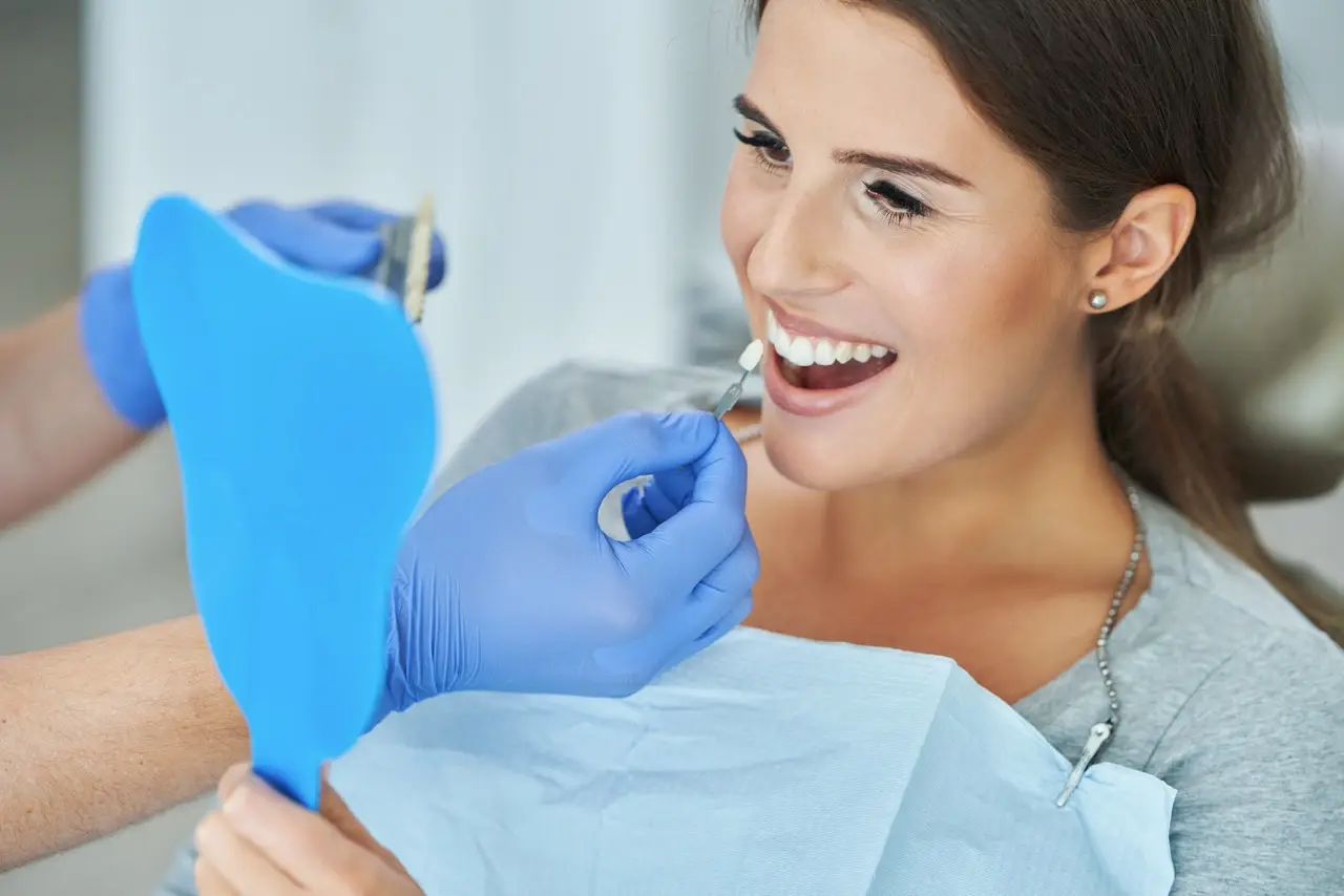 Male dentist and woman in dental clinic